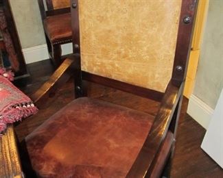 A close-up of one of the 2 captains chairs finished in leather.