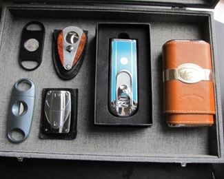 For the distinguished gentleman, a nice collection of cigar cutters, lighter, and cases. As well as 2 humidors that every man should have.
