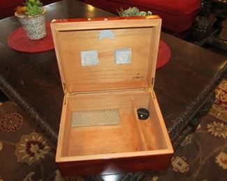 For the distinguished gentleman, a nice collection of cigar cutters, lighter, and cases. As well as 2 humidors that every man should have.