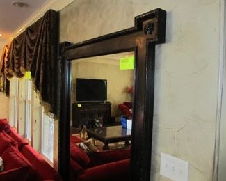 Large oversized beveled mirror in a rustic thick wooden frame w/ decorative medallions in each corner.  A statement piece for sure!  (TV not available)