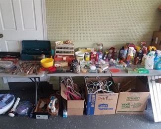 Garage with small assortment of tools, cleaning products. 