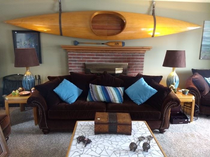 Wooden kayak, sofa, two matching lamps, end tables, countless home decor.