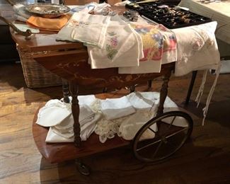 Tea cart with matching small table that is a jewelry and music box, linens, watches