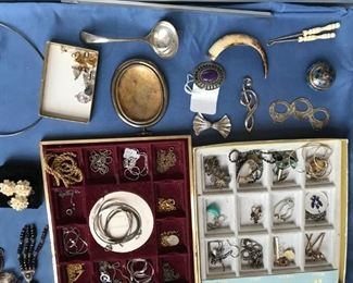 Sterling silver charms, frame, ladle and brooches. Victorian boar tusk brooch. 