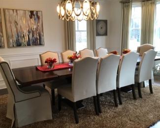 Large dining room table comes with 10 chairs... two inserts 