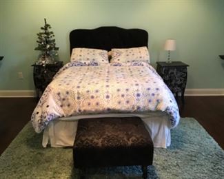 Queen size bed with Purple cushion headboard 
