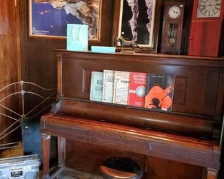 Antique upright piano.  Antique piano stool.
