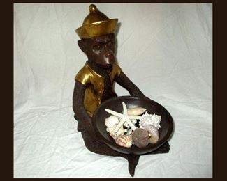 Cute Little Monkey Holding Shells 