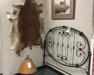 Soft tanned hide, lamps, wrought iron bed, Michael Glenn Monroe signed print