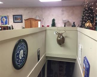White tail deer taxidermy, Rolling Rock beer sign, LaBatt beer sign, Christmas trees