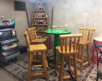 log cabin bar stools, hi-top tables, arcade games, boat shaped bookcase