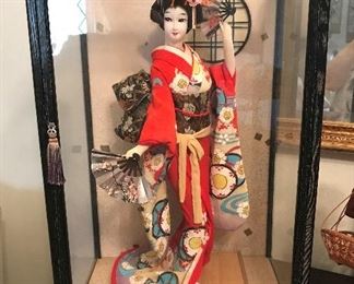 Oriental doll in case