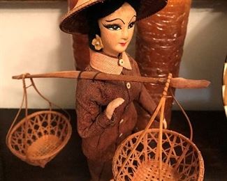 Oriental doll with baskets