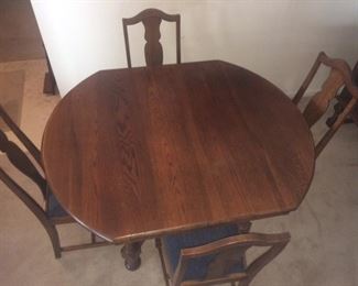 antique oak table (SOLD) - shown with 4 chairs, there is a leaf and 2 more chairs (CHAIRS STILL AVAILABLE)