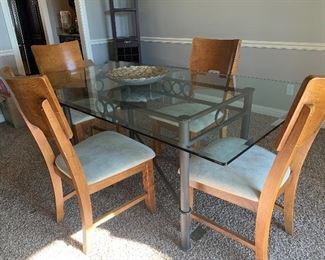 OFF SITE - Glass top modern dining room or kitchen table set.  Table/4 chairs. $350. CASH