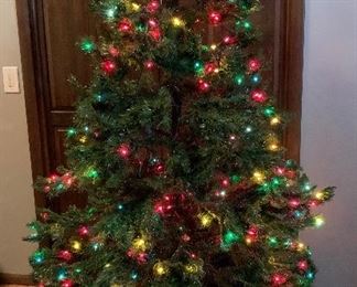 6ft Pre-lit Christmas tree that needs to have a couple of stands of lights added.  Comes with stand and storage bag $30