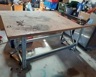 Heavy duty metal base table - dollies and contents not included