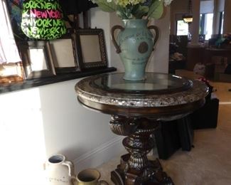 Pedestal Table with Floral Arrangements and Decorative Pots