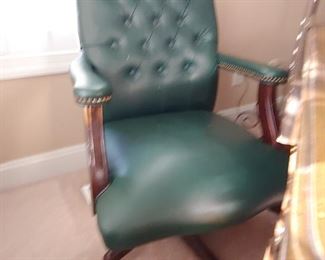 Beautiful tufted forest green leather executive chair. 