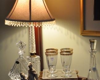 Antique Tiffin Rambler Rose crystal beverage glasses with gold trim shown with a Waterford and vintage BLOCK Olympic Crystal Triangular Decanter as well as one of the many antique figurines throughout the home!