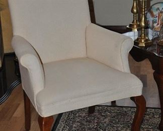 One of the two ivory upholstered Wingback arm chairs available, 30"w x 41"h x 23"d