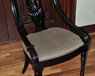 Carved black desk chair with striped upholstery seat