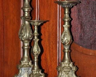 Set of three Victorian heavy gold gilded candlesticks. 18", 15" and 12'