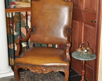 Another fabulous oversized leather chair shown with a petite 12" round mahogany candlestick table/plant stand with a marble top by Bombay Co., 21"h