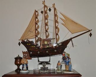 33" Viking style decorative wooden sailing ship  shown with vintage porcelain figurines