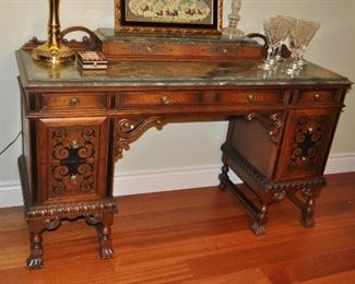 Exquisite detail on the 8 drawer mahogany desk with black inlay design and marble top! 54"w x 34"h x 18"d