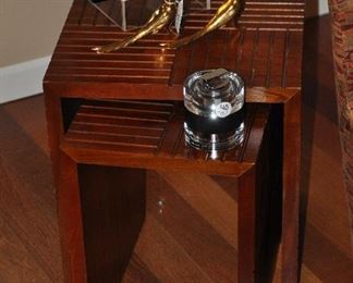 A pair of cherry nesting tables ( largest is 16" x 16" x 18") shown with a mid century lucite table lighter, made in Italy, a pair of painted gold peacocks and a black lacquer "E" box from C Wonder