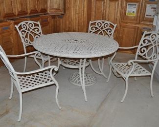 Outdoor white painted metal dining table and 4 chair set, cushions included (not shown)