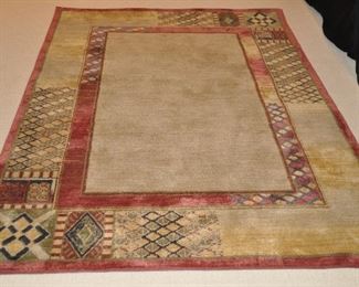 Machine made geometric area rug