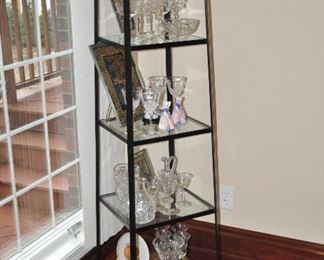 Fantastic 5 shelf iron and glass display unit. 29" square at the base tapered to the top.  64" tall.  Shown with a variety of glass and stemware.