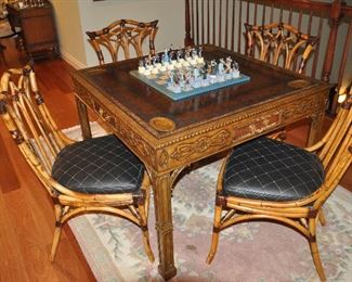 Exquisite carved mahogany Maitland Smith Game Table shown with a set of 4 amazing Pierce Martin black leather upholstered bamboo chairs. Also shown is a pink floral oriental wool area rug, 5'2" x 8'2"