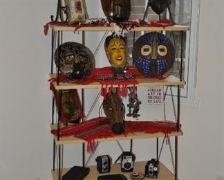 Great open display/bookshelf shown with vintage African carved masks and African tapestries in a variety of sizes. Shelf is 32"w x 57"h x 16"d