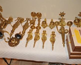 Fantastic collection of wall mounted brass candle holders!