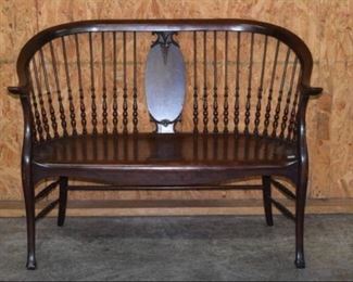 Carved Mahogany spindle back settee 