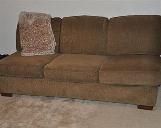 Brown upholstered arm-less sofa, 71"W x 36"D x 33"H from Art Van 