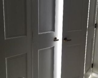 Solid wood interior bi-fold doors throughout