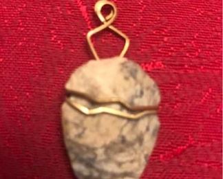 Arrowhead and metal pendant