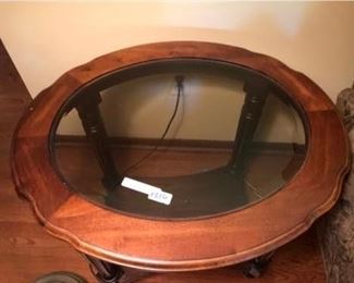 Oval wood and glass side table with bottom shelf