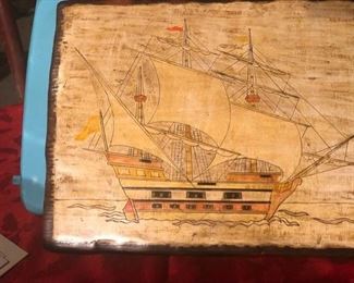 Painted ship on heavy wood
