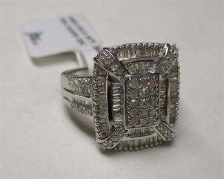 Thai Rhodium plated ring with tested low grade round and baguettes  cut diamonds