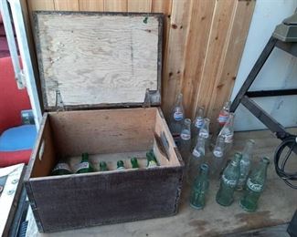 Wood crate with assorted glass pop bottles