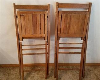 2 wooden folding chairs