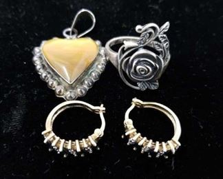 Pair of sterling earrings, ring, and pendant