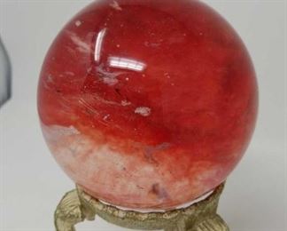 red crystal ball on stand
