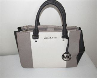 Michael Kors handbag white, gray and black.  Does have a little damage to the emblem