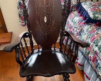 Mahogany rocking chair with mother of pearl inlaid. "1800's"